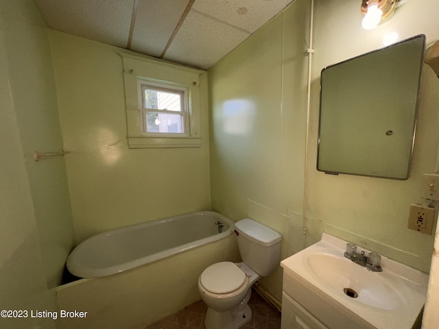 bathroom featuring vanity, toilet, and a bathing tub