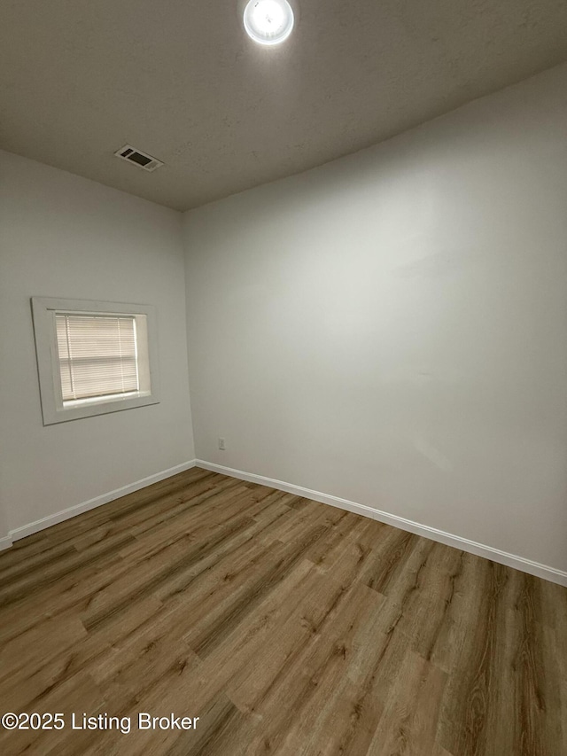 unfurnished room featuring light hardwood / wood-style flooring