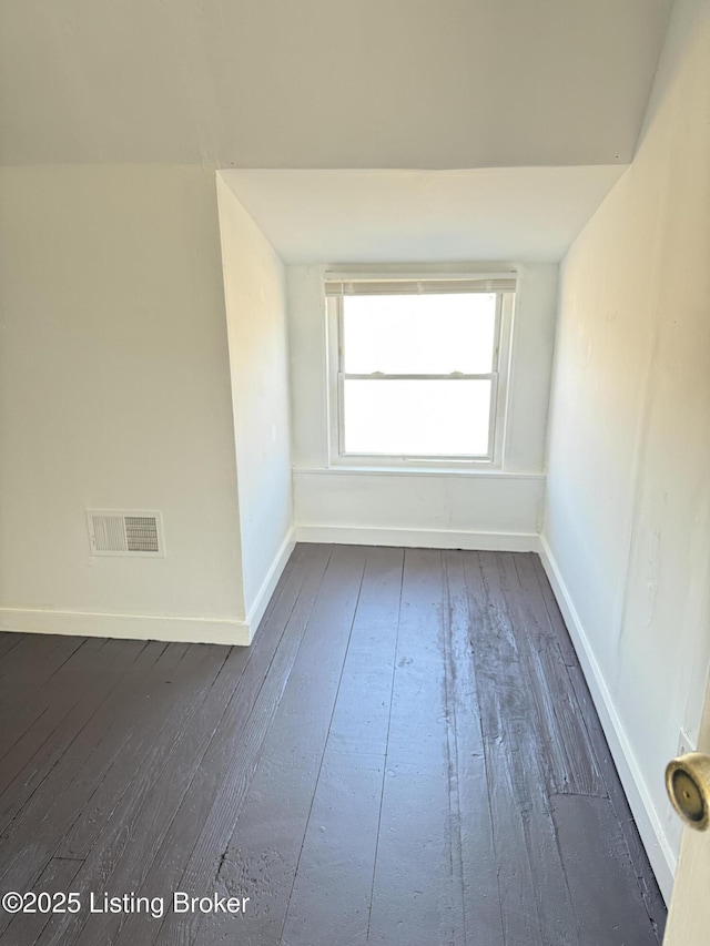 empty room featuring dark hardwood / wood-style flooring