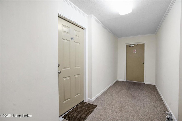 hallway featuring a textured ceiling, crown molding, and light carpet