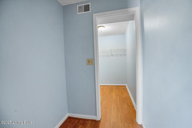 hall with light hardwood / wood-style flooring