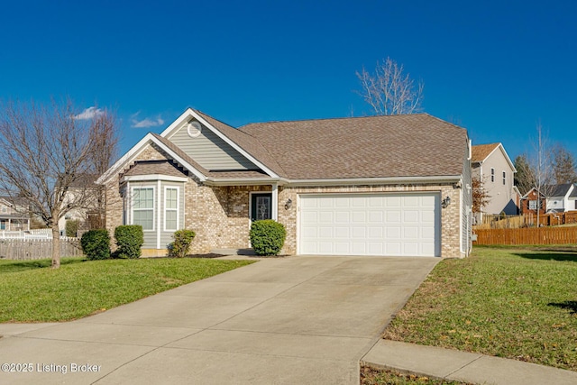 view of front facade with a front yard and a garage