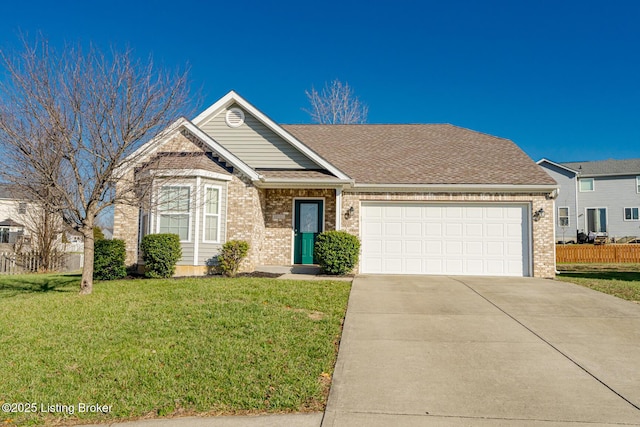 view of front of house with a front yard and a garage