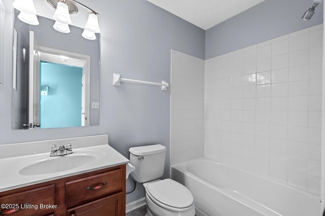 full bathroom featuring shower / bathing tub combination, toilet, and vanity