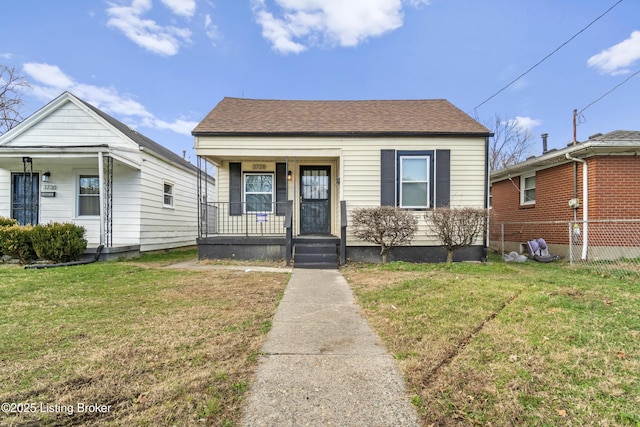 bungalow-style house with a porch and a front yard