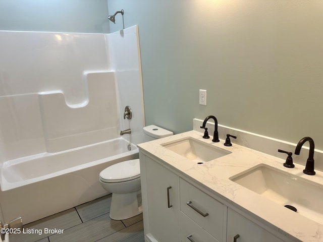 full bathroom with vanity, toilet, and bathtub / shower combination