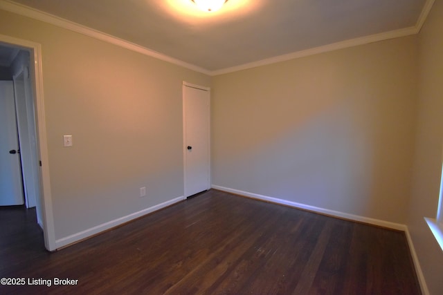 unfurnished room with dark hardwood / wood-style flooring and ornamental molding