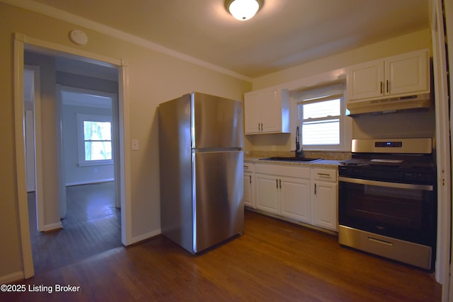 kitchen with a healthy amount of sunlight, sink, white cabinetry, and stainless steel appliances