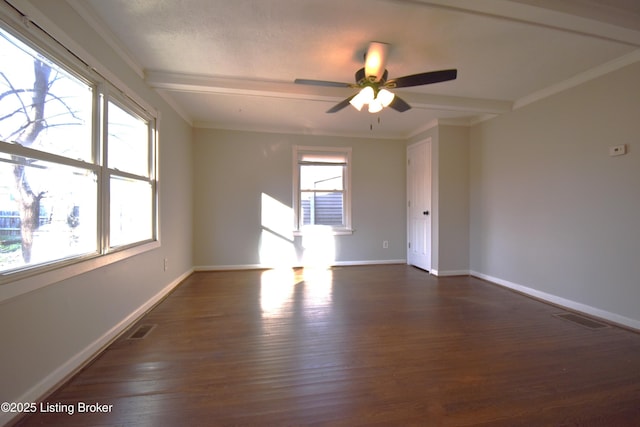 unfurnished room with beam ceiling, ornamental molding, ceiling fan, and dark wood-type flooring