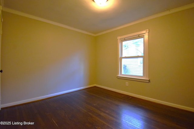 unfurnished room with dark hardwood / wood-style flooring and crown molding