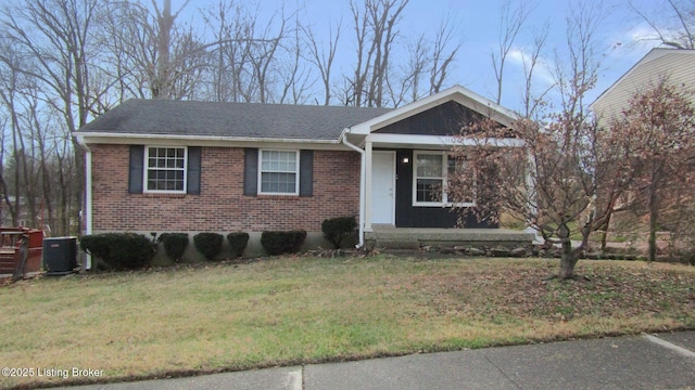 view of front facade featuring central AC unit and a front lawn