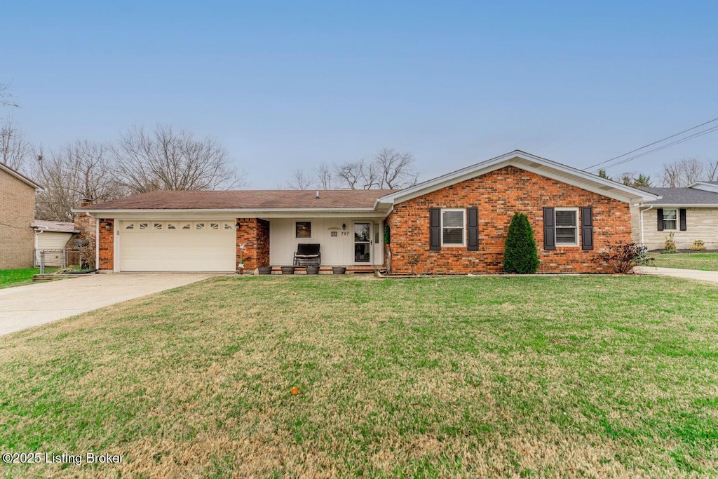 ranch-style home featuring a front yard and a garage