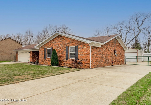 view of front of house featuring a garage and a front lawn