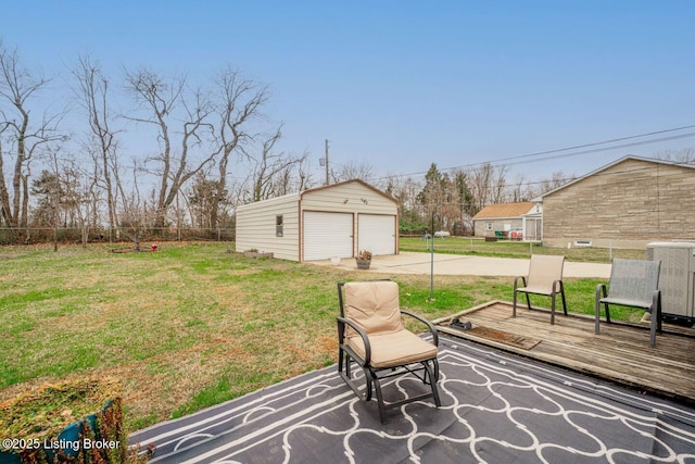 view of patio / terrace with a deck, a garage, and an outdoor structure