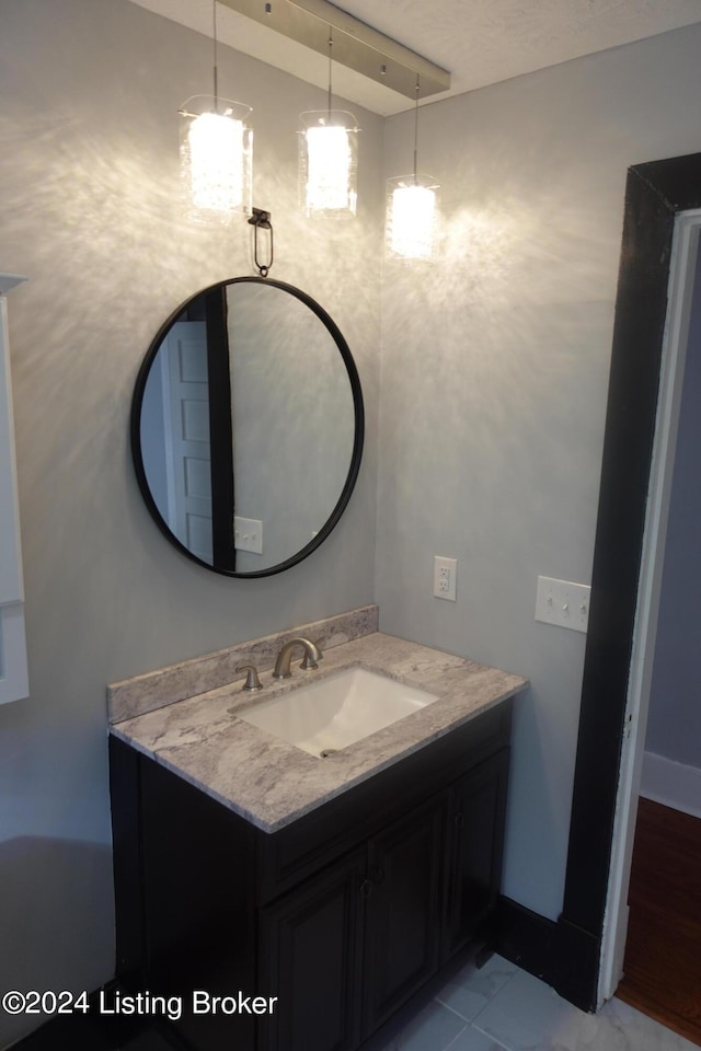 bathroom featuring tile patterned floors and vanity