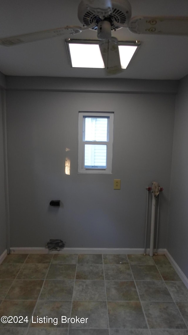 laundry area with ceiling fan