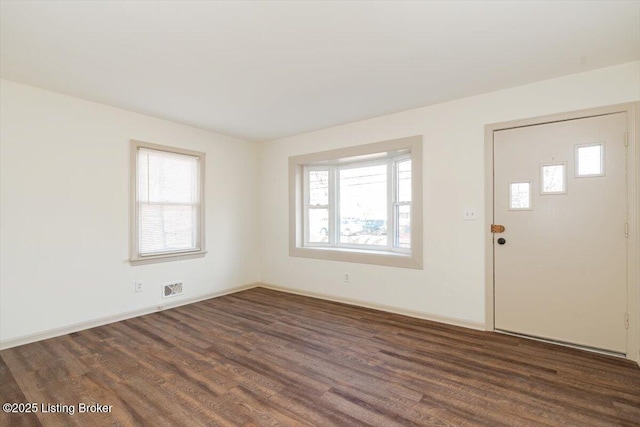 foyer entrance with dark hardwood / wood-style flooring