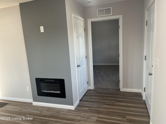 hall with dark hardwood / wood-style floors