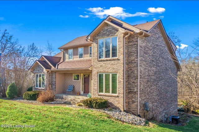 front facade with a front lawn and central AC unit