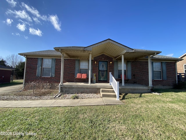 view of front of house with covered porch and a front lawn