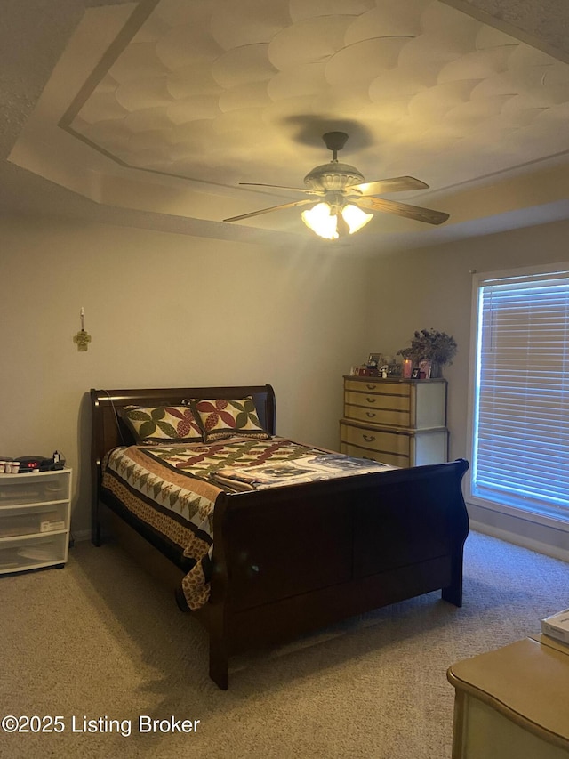 bedroom featuring ceiling fan and light colored carpet