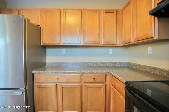 kitchen featuring stainless steel refrigerator