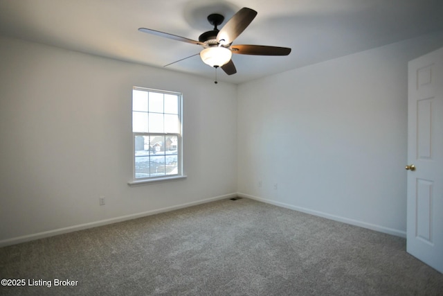 carpeted empty room with ceiling fan