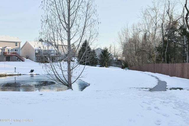 view of yard covered in snow