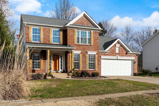 view of front of home with a front yard and a garage