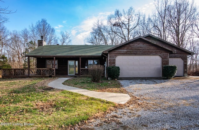 single story home featuring a porch and a garage