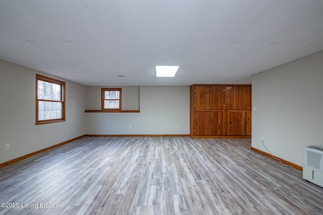 spare room with light hardwood / wood-style floors