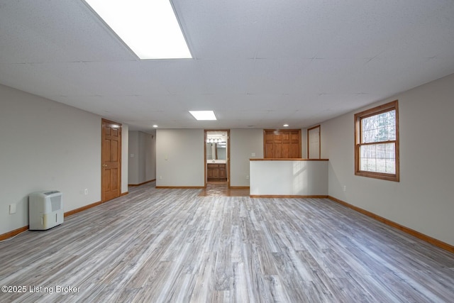 unfurnished living room with light wood-type flooring