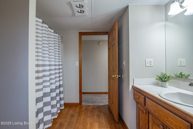 bathroom with vanity and hardwood / wood-style flooring