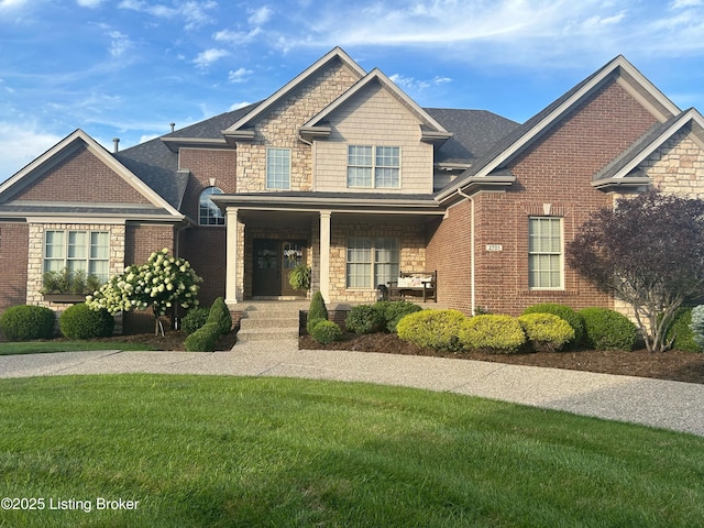 craftsman-style house with a porch and a front lawn