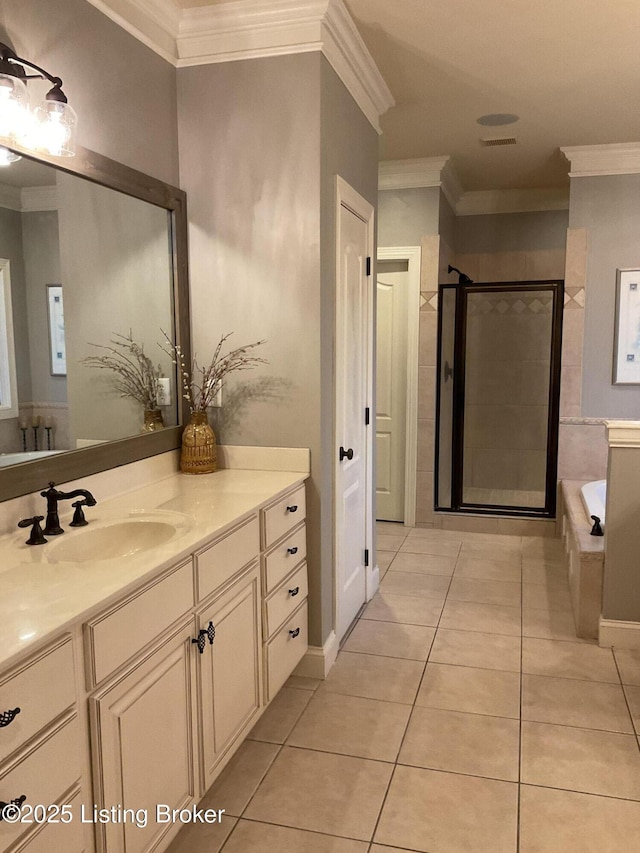 bathroom with vanity, ornamental molding, separate shower and tub, and tile patterned flooring