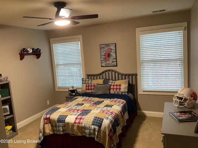 carpeted bedroom with ceiling fan