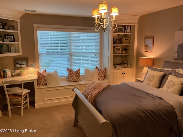 carpeted bedroom featuring an inviting chandelier