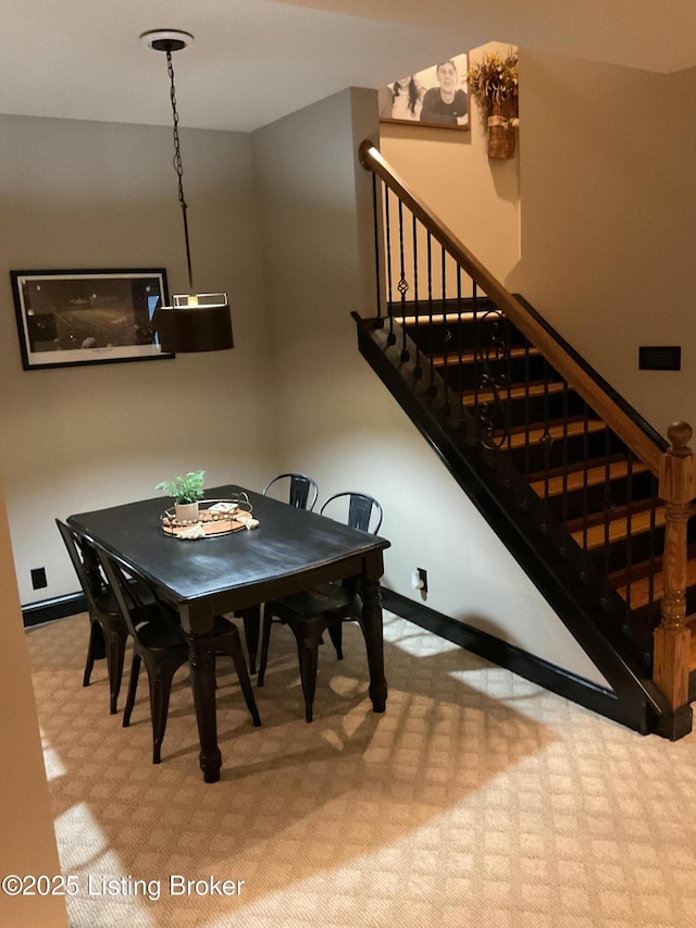 view of carpeted dining space