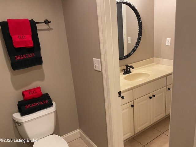 bathroom with tile patterned floors, vanity, and toilet