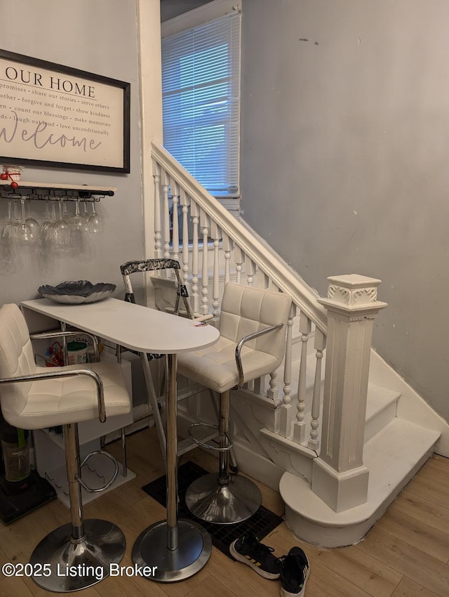 dining space with wood-type flooring