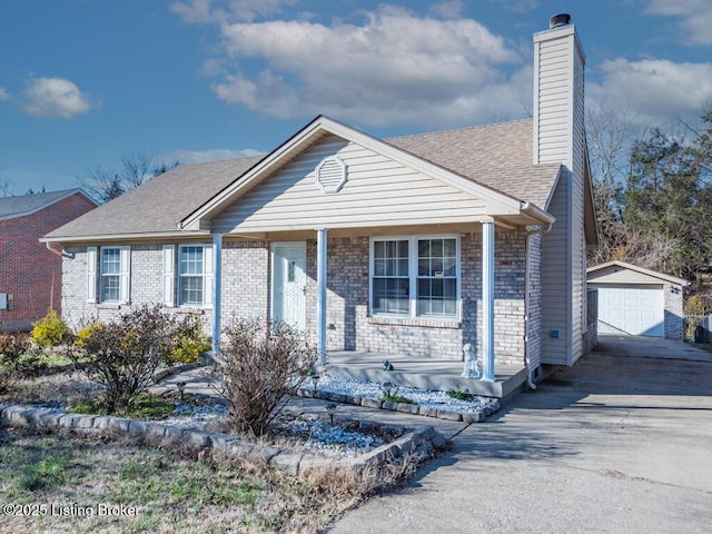 view of front of house with a garage, an outdoor structure, and covered porch