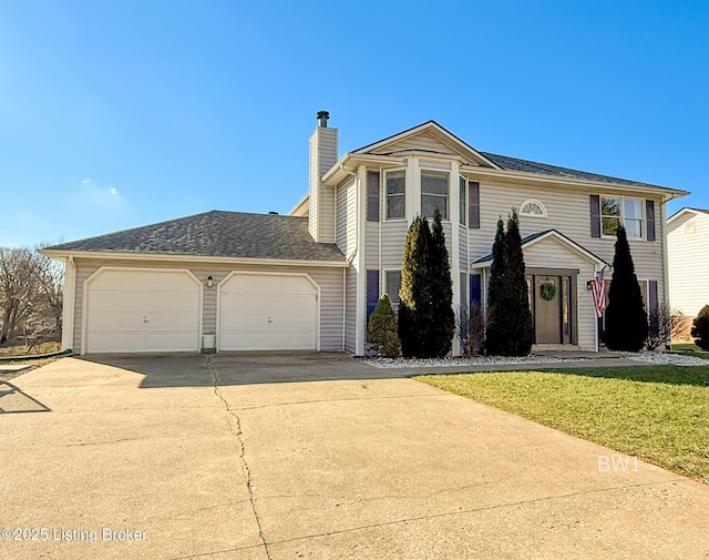 view of front property with a front yard and a garage