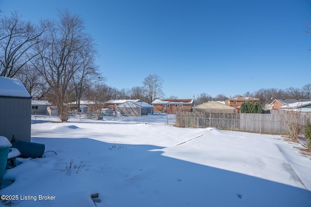 view of yard layered in snow