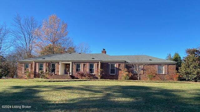 ranch-style home featuring a front yard