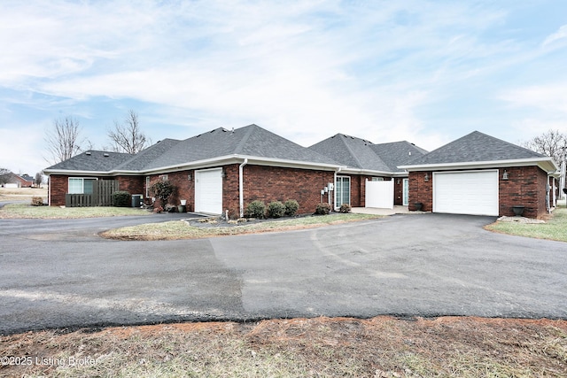 ranch-style home featuring a garage