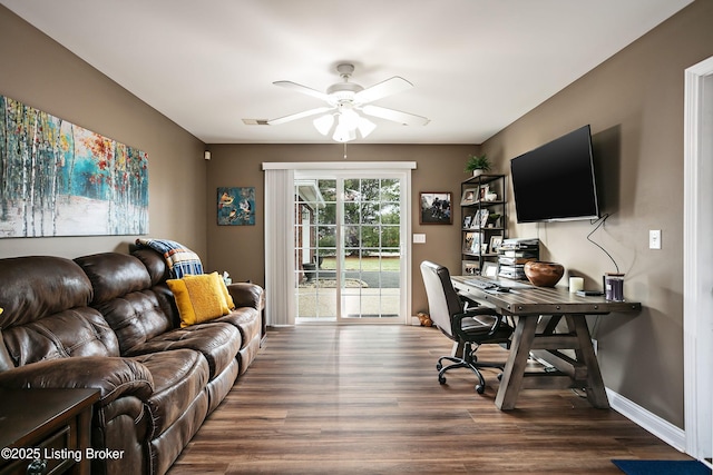 office area with ceiling fan and dark hardwood / wood-style flooring