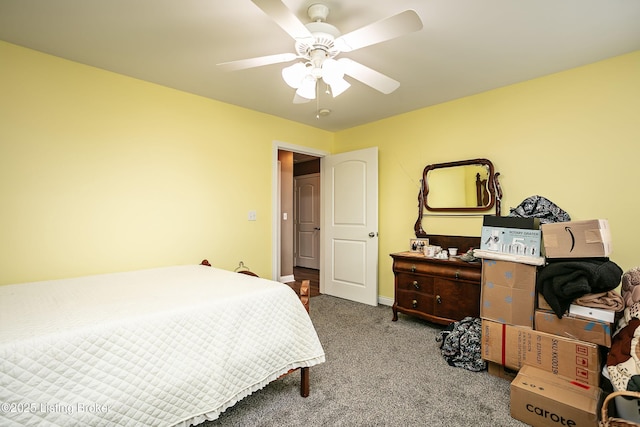 bedroom featuring ceiling fan and carpet