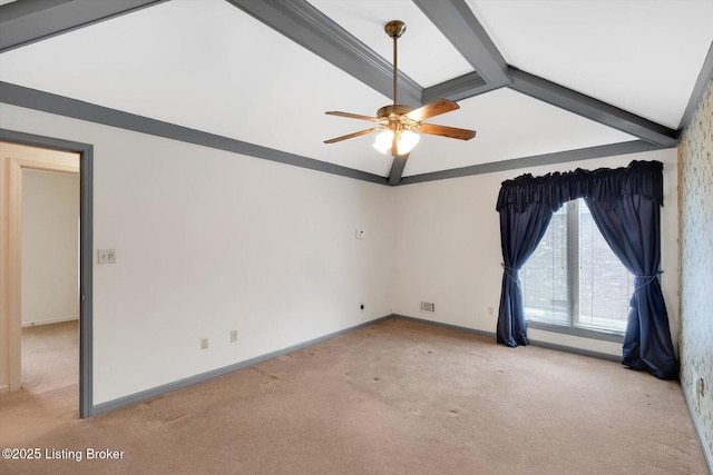 unfurnished room with beamed ceiling, light colored carpet, visible vents, and ceiling fan