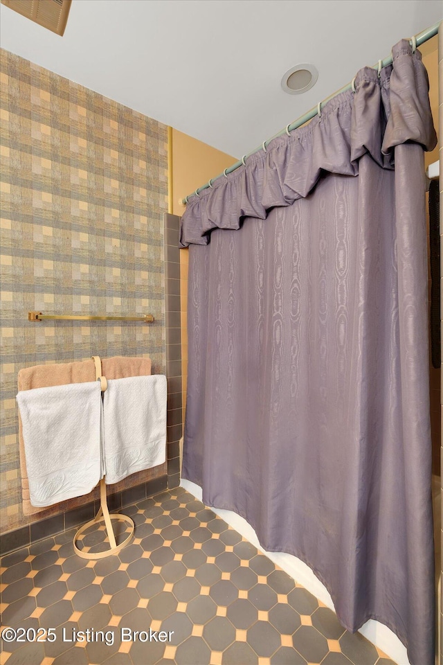 bathroom with a shower with shower curtain