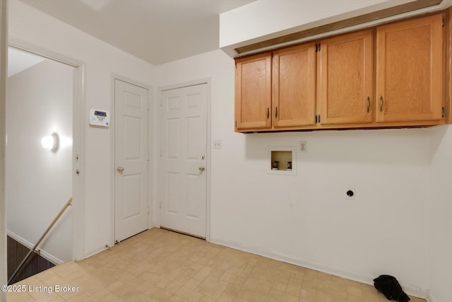 clothes washing area featuring cabinet space, electric dryer hookup, and washer hookup